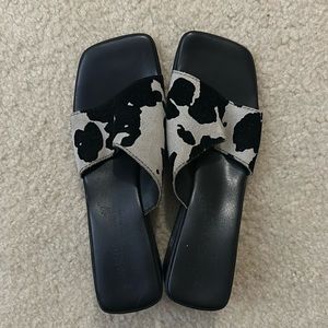 Woman’s size 8 black, and white wedge shoe